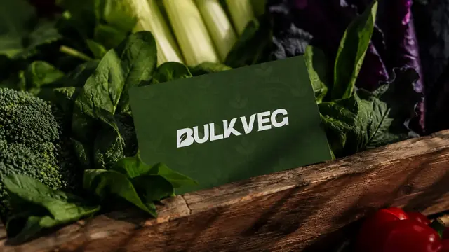 A Bulkveg card among fresh vegetables